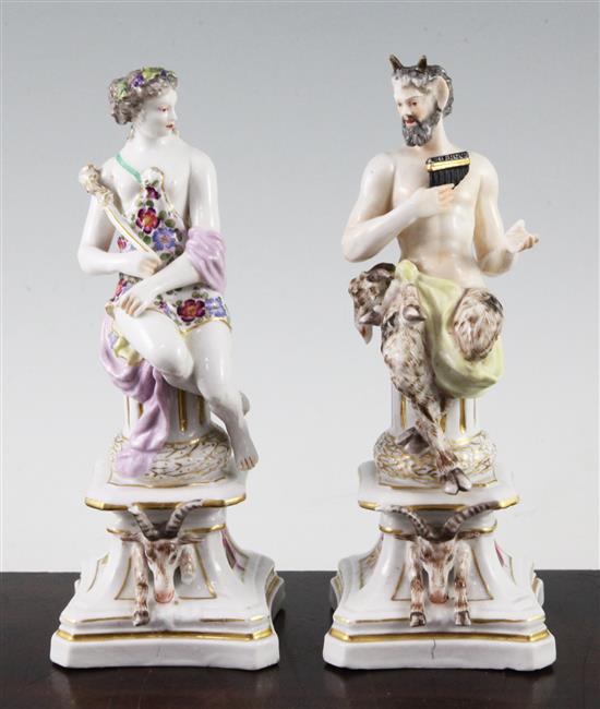 A pair of Samson of Paris porcelain figures of Pan and a nymph, late 19th century, 20.5cm and 20cm